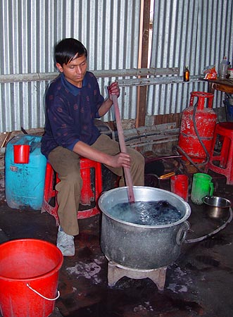 Bishnu stirring a shawl