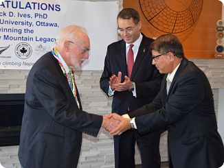 Dr. Jack Ives congratulated by H.E. Kali Prasad Pokhrel